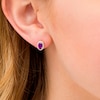 Thumbnail Image 1 of Oval Amethyst and 1/10 CT. T.W. Diamond Frame Stud Earrings in 10K Gold
