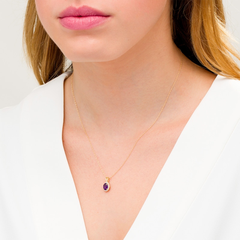 Oval Amethyst and 1/15 CT. T.W. Diamond Frame Pendant in 10K Gold