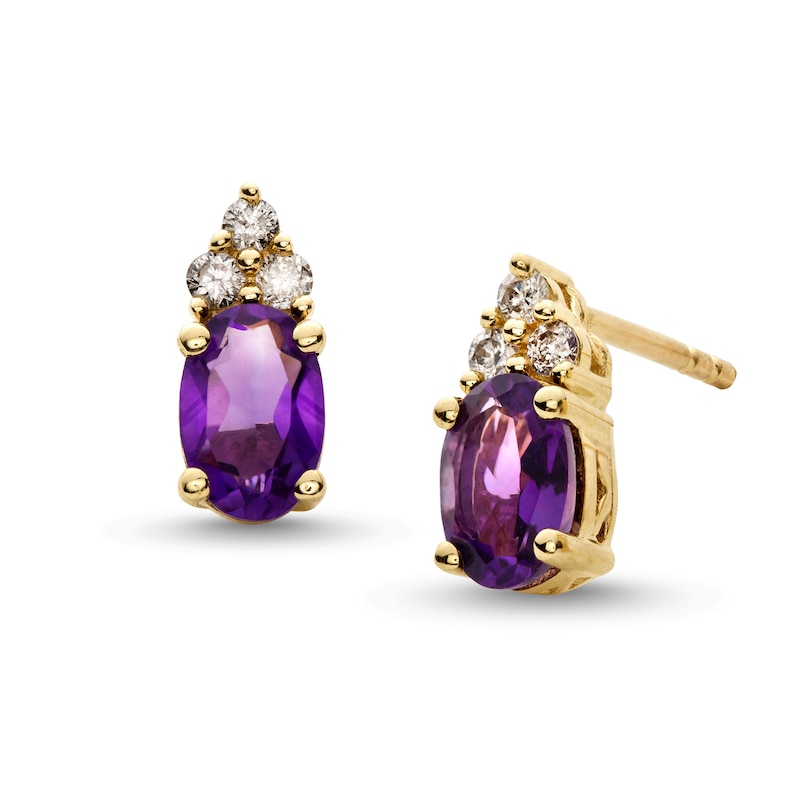 Oval Amethyst and 1/10 CT. T.W. Diamond Tri-Top Stud Earrings in 10K Gold